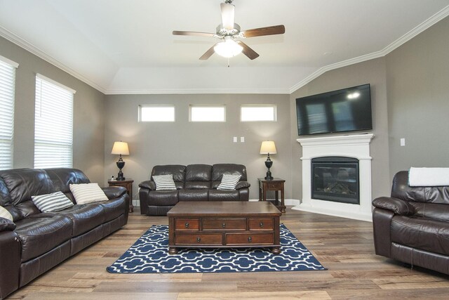 living room featuring ornamental molding, ceiling fan, and light hardwood / wood-style flooring