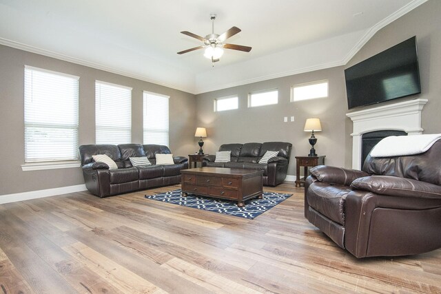 living room featuring ornamental molding and light hardwood / wood-style floors