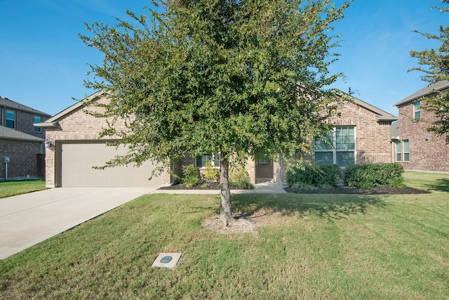 view of property hidden behind natural elements with a garage and a front lawn