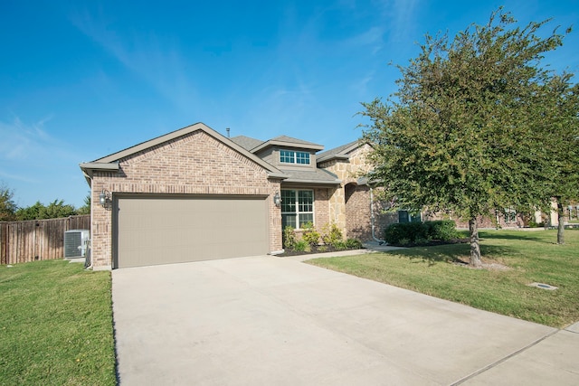 view of front of property featuring a front yard and a garage