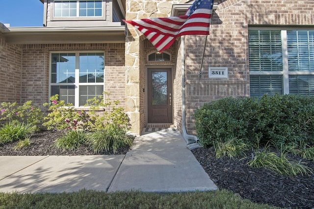 property entrance with brick siding