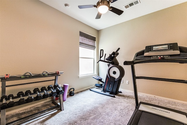 workout room with ceiling fan and carpet floors