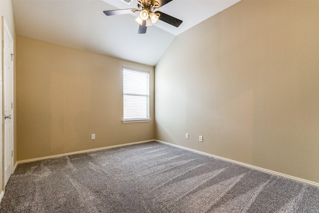 carpeted empty room with ceiling fan and vaulted ceiling