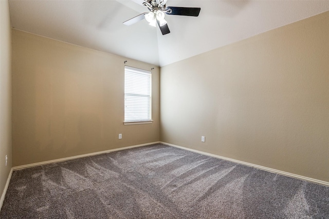 carpeted spare room featuring ceiling fan and lofted ceiling