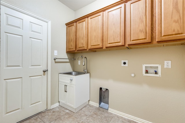 laundry room with electric dryer hookup, light tile patterned flooring, washer hookup, cabinets, and sink