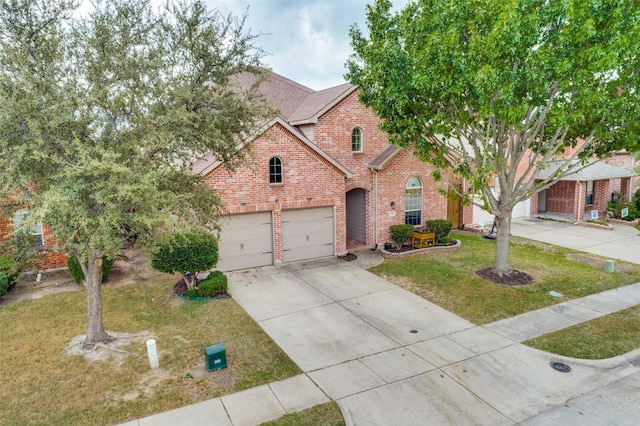 view of front facade with a garage, driveway, brick siding, and a front yard