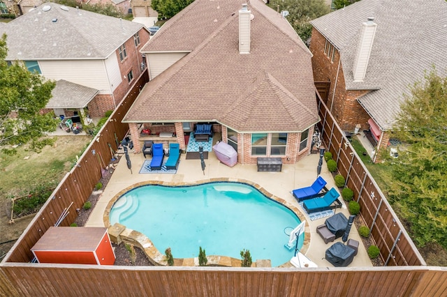 view of swimming pool with a patio