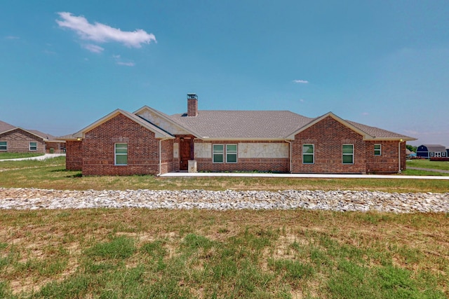 single story home with a front yard