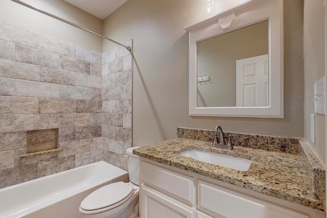 full bathroom featuring vanity, toilet, and tiled shower / bath combo