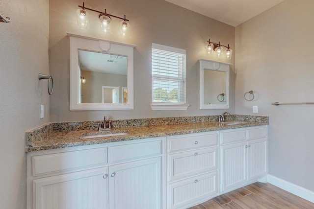 bathroom featuring vanity and hardwood / wood-style flooring