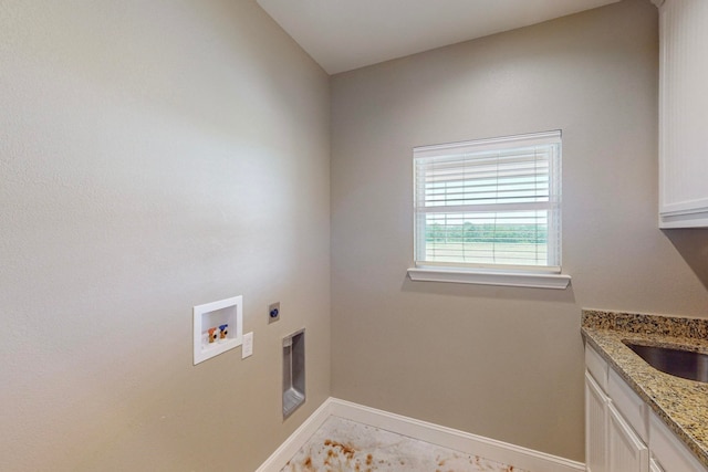 laundry room featuring washer hookup, hookup for an electric dryer, and cabinets