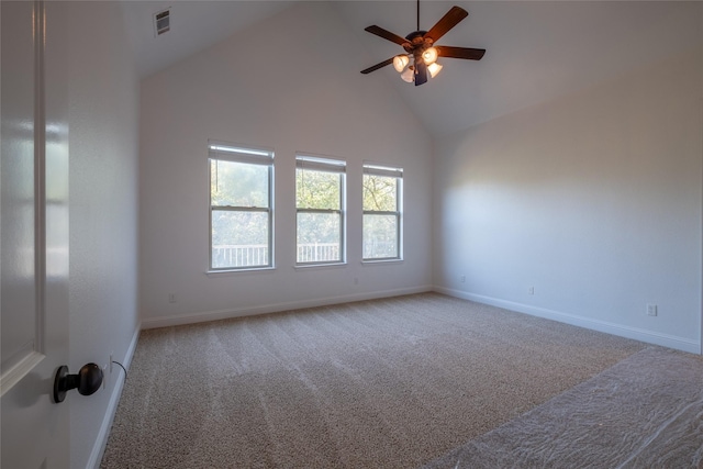 carpeted spare room featuring baseboards, a ceiling fan, visible vents, and high vaulted ceiling