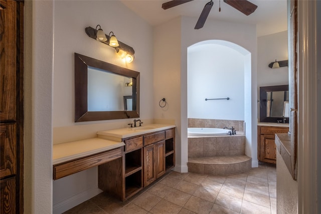 full bathroom with vanity, ceiling fan, a garden tub, and tile patterned flooring