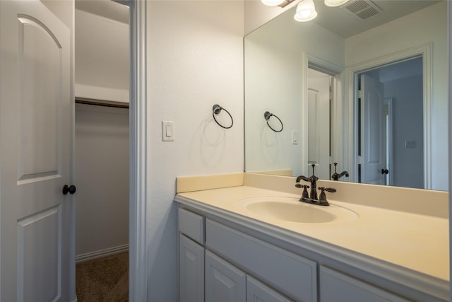 bathroom featuring visible vents and vanity
