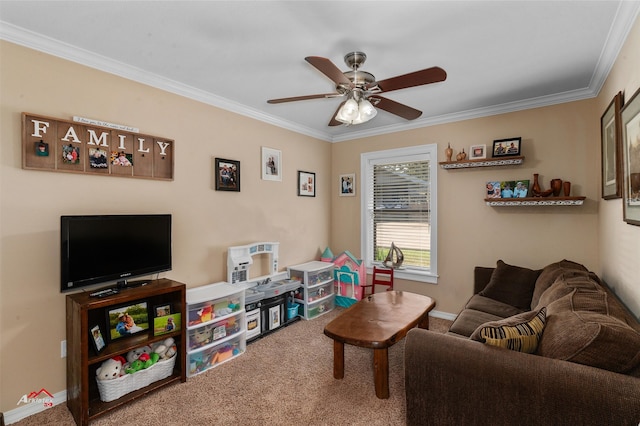 carpeted living room with crown molding and ceiling fan