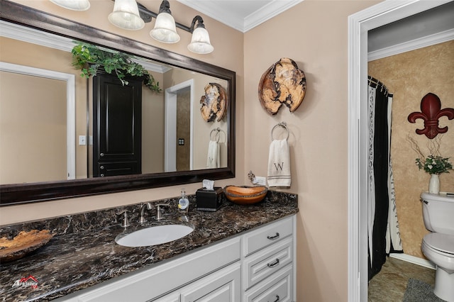 bathroom with crown molding, vanity, and toilet