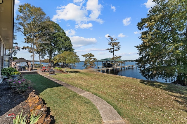 dock area featuring a water view and a lawn