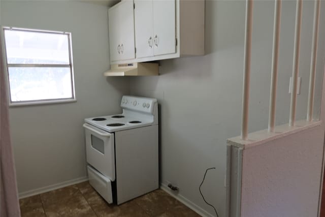 laundry room with dark tile patterned flooring