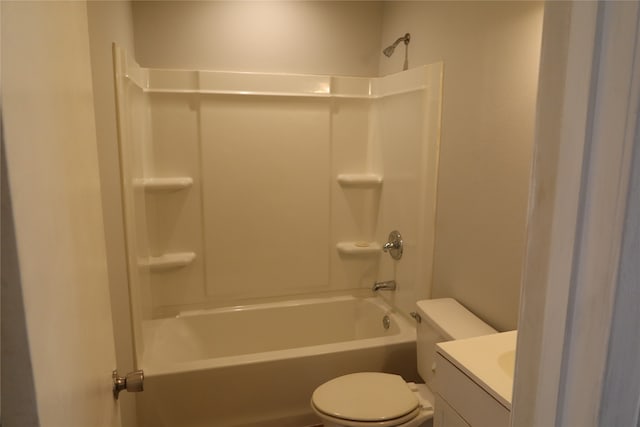 full bathroom featuring bathtub / shower combination, vanity, and toilet