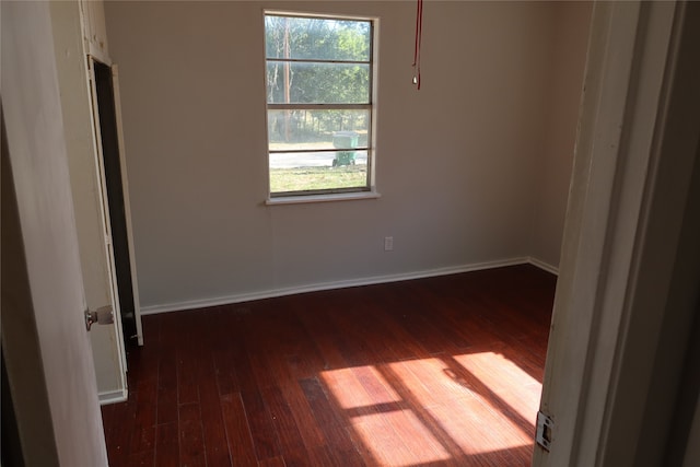 spare room featuring dark hardwood / wood-style floors