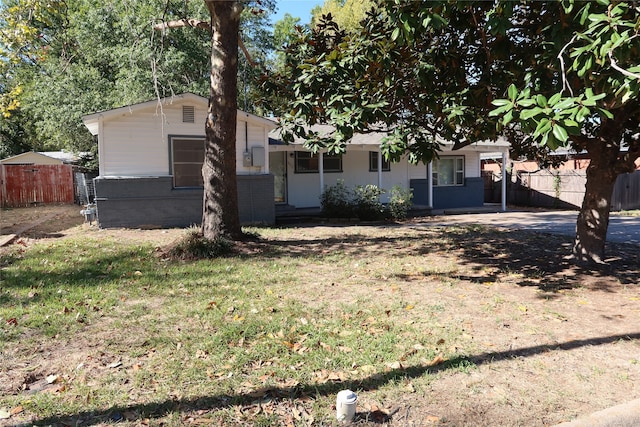 ranch-style house with a front lawn