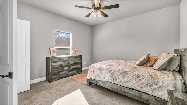 bedroom featuring light colored carpet and ceiling fan