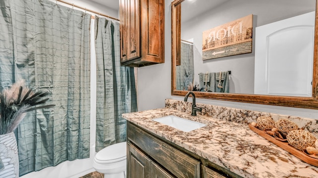 full bathroom featuring shower / bathtub combination with curtain, vanity, and toilet