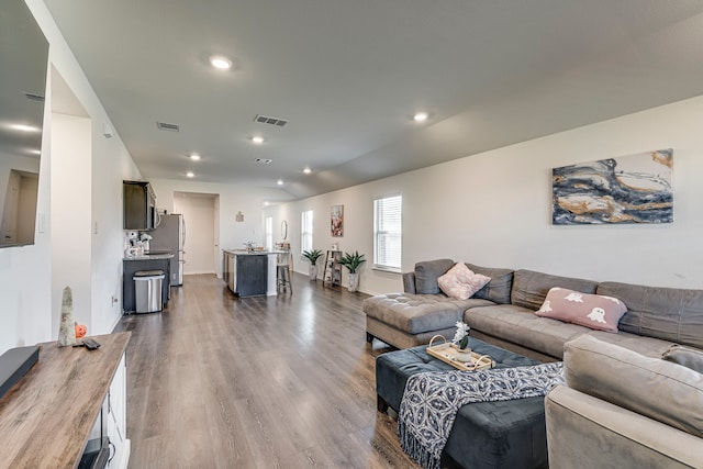 bedroom with ceiling fan, vaulted ceiling, and carpet