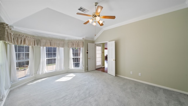 unfurnished room with crown molding, ceiling fan, vaulted ceiling, and carpet