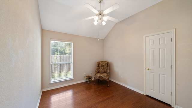 unfurnished room with lofted ceiling, dark hardwood / wood-style floors, and ceiling fan