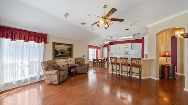 living room with ornamental molding, lofted ceiling, ceiling fan, and dark hardwood / wood-style floors