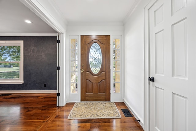 foyer entrance featuring wood-type flooring and ornamental molding