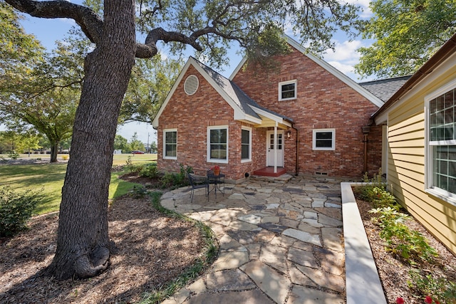 back of house featuring a patio area