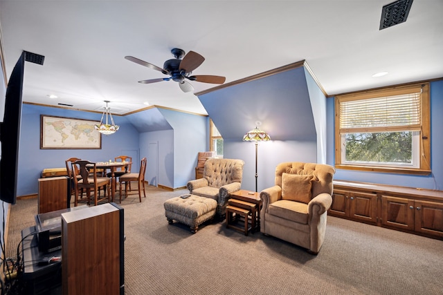 living area featuring crown molding, light colored carpet, vaulted ceiling, and ceiling fan