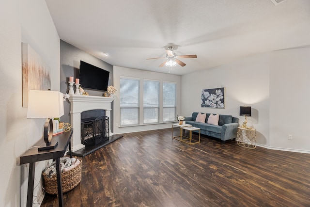 living room with ceiling fan and dark hardwood / wood-style floors