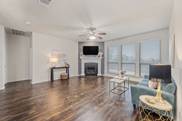 living room with dark hardwood / wood-style floors and ceiling fan