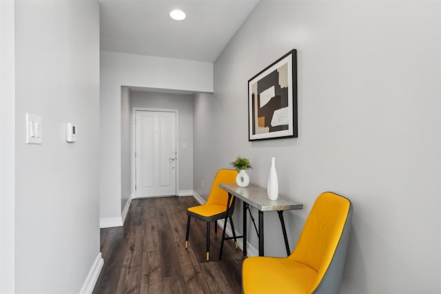 hallway with dark hardwood / wood-style floors