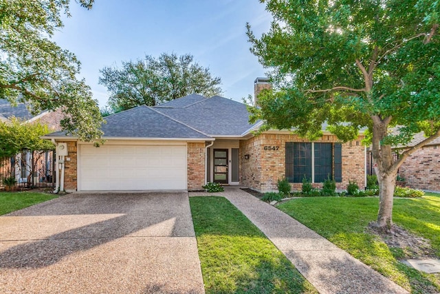 single story home featuring a front lawn and a garage