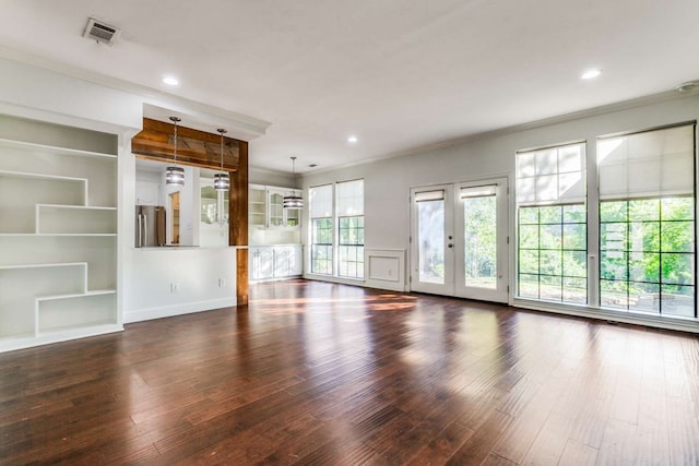 unfurnished living room with french doors, dark hardwood / wood-style floors, and crown molding