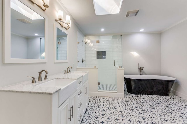 bathroom featuring ornamental molding, a skylight, and independent shower and bath