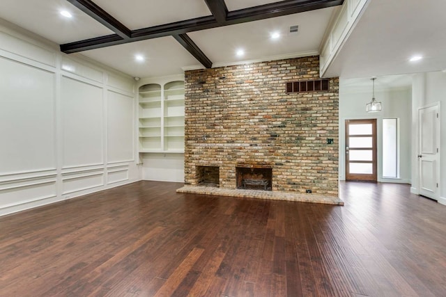 unfurnished living room featuring dark hardwood / wood-style floors, brick wall, beam ceiling, and coffered ceiling