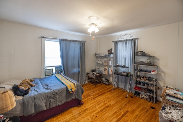 bedroom featuring wood-type flooring and ceiling fan