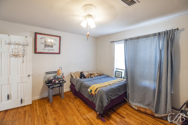 bedroom featuring ceiling fan and light hardwood / wood-style floors