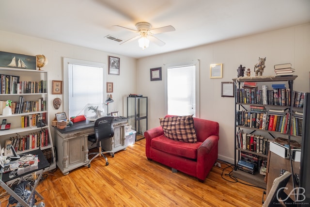 office space with light wood-type flooring and ceiling fan