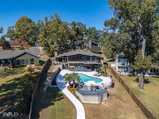 view of swimming pool with a patio area and a yard