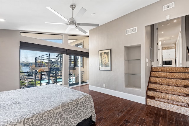 bedroom with lofted ceiling, access to exterior, dark hardwood / wood-style floors, and ceiling fan