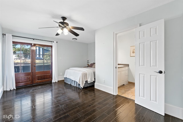 bedroom featuring ceiling fan, ensuite bath, and dark hardwood / wood-style floors