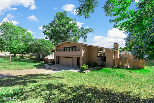 view of front of house with a garage and a front lawn