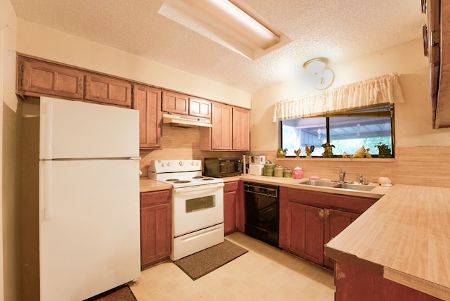 kitchen with black appliances, sink, and a textured ceiling