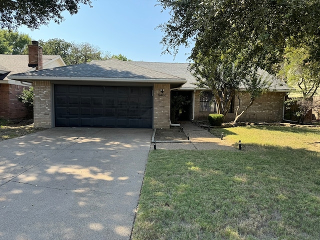 single story home featuring a front yard and a garage